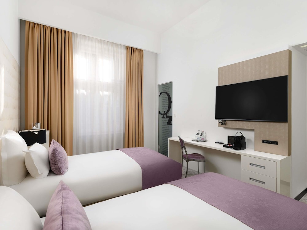 Habitación superior con 2 camas individuales y posibilidad de cama supletoria del hotel Nemzeti Budapest – Mgallery. Foto 2