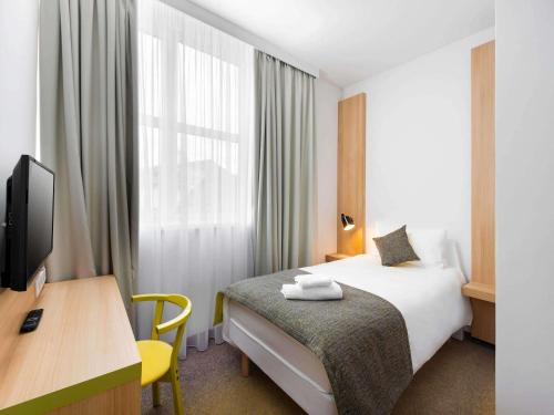 Habitación Familiar con 1 cama doble y 1 cama individual del hotel Ibis Styles Budapest City. Foto 5
