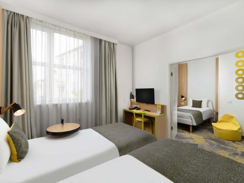 Habitación Familiar con 1 cama doble y 1 cama individual del hotel Ibis Styles Budapest City. Foto 6