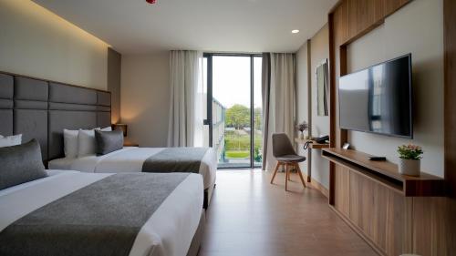 Habitación Doble Deluxe - 2 camas del hotel Canalis Suvarnabhumi Airport. Foto 11