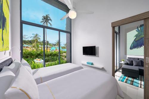 Suite Twin con Una Dormitorio del hotel Cassia Bintan. Foto 1