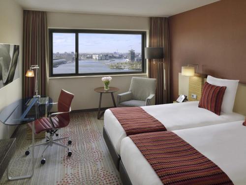 Habitación Doble Executive con vistas - 2 camas del hotel Mövenpick Amsterdam City Centre. Foto 1