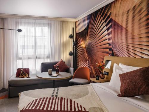 Habitación Doble Clásica con sofá cama individual del hotel Novotel Paris Vaugirard Montparnasse. Foto 5
