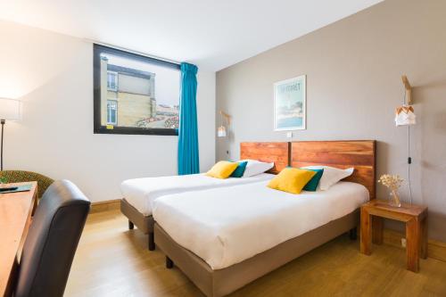 Estudio con 2 camas individuales del hotel Victoria Garden Bordeaux Centre. Foto 5