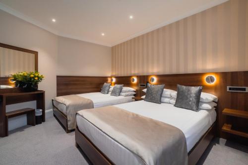 Habitación Familiar del hotel London House. Foto 1