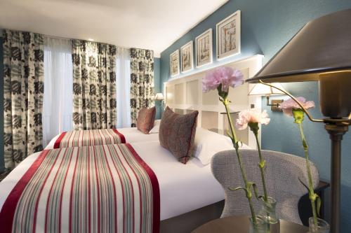 Habitación Twin Estándar del hotel Les Tournelles. Foto 6