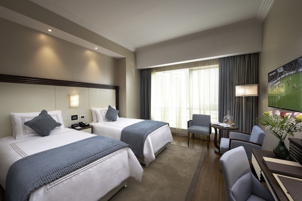 Habitación Deluxe con 2 camas individuales, vistas al puerto deportivo del hotel Stella Di Mare Dubai Marina. Foto 1