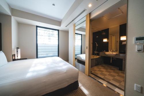 Habitación Deluxe con cama extragrande - Adaptada para personas de movilidad reducida - No fumadores del hotel KOKO Premier Kanazawa Korinbo. Foto 8