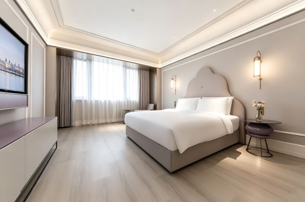 Suite Deluxe con 1 cama King Size del hotel Mercure Xian Dayan Pagoda. Foto 12