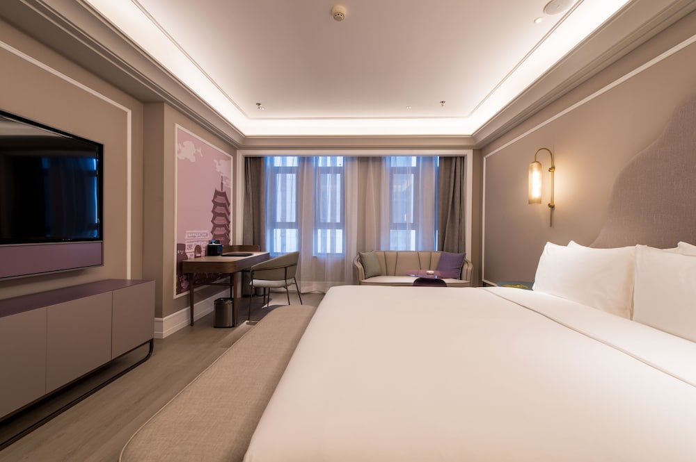Habitación Deluxe, 1 cama de matrimonio grande del hotel Mercure Changchun Hengxing. Foto 1