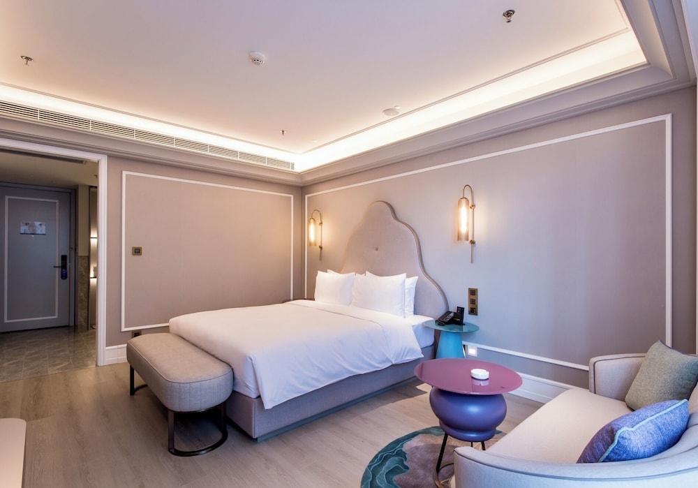 Habitación Deluxe, 1 cama de matrimonio grande del hotel Mercure Changchun Hengxing. Foto 3