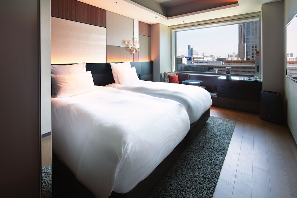 HABITACIÓN EXECUTIVE DELUXE, Acceso al Lounge, 2 camas individuales del hotel Pullman Tokyo Tamachi. Foto 1