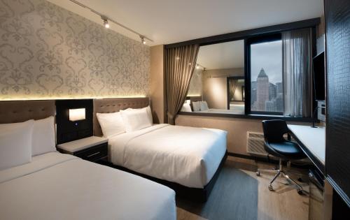 Habitación Doble Deluxe del hotel Aliz Times Square. Foto 1