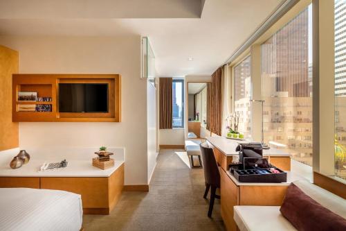 Habitación adaptada para personas con movilidad reducida - Cama grande del hotel Concorde New York. Foto 1