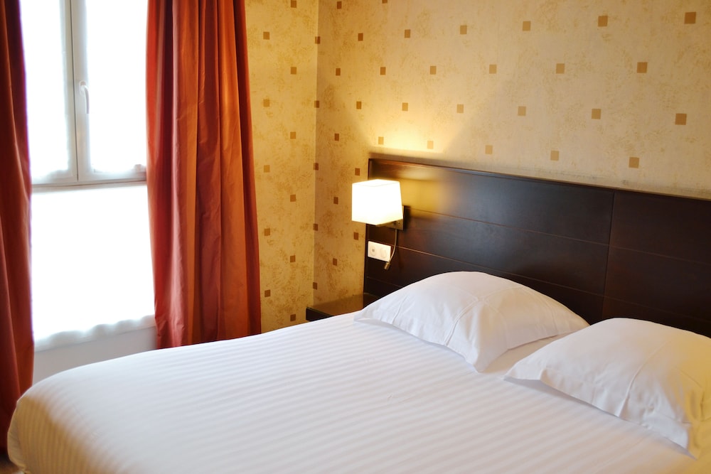 Habitación superior con 1 cama doble o 2 individuales del hotel Exposition Tour Eiffel. Foto 3