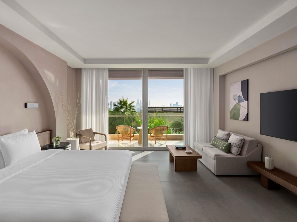Habitación Deluxe, 1 cama de matrimonio grande del hotel Rixos The Palm & Suites. Foto 6