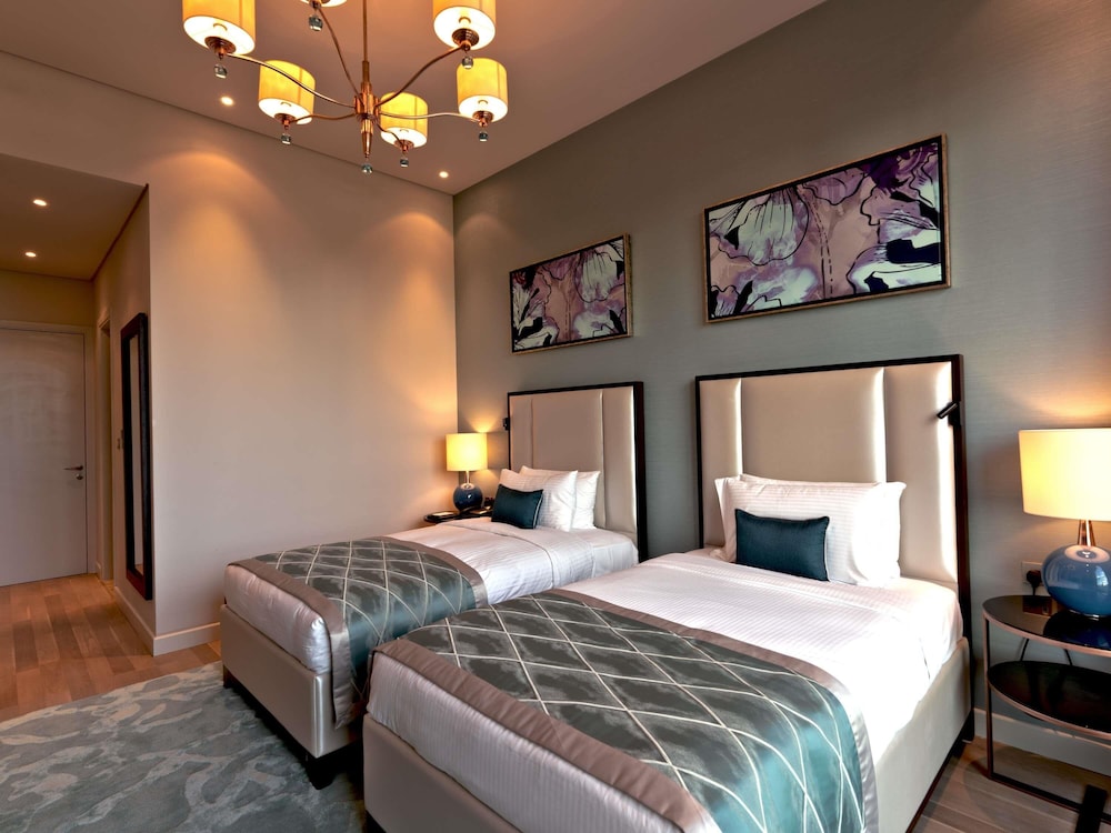 Suite familiar, 3 habitaciones del hotel Rixos The Palm & Suites. Foto 2