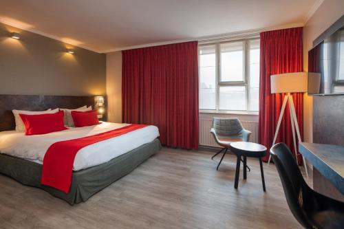 Habitación con cama extragrande. del hotel Martin's Brussels Eu