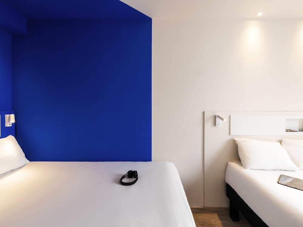 Habitación Estándar con dos camas matrimoniales del hotel ibis budget Aguascalientes Norte. Foto 1