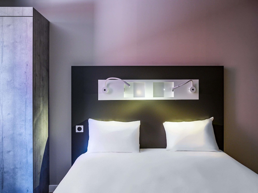 Habitación triple estándar, varias camas, accesible para personas con discapacidad del hotel Ibis Budget Saint-Etienne Centre Gare Châteaucreux. Foto 1