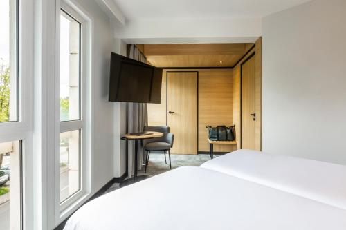 Habitación Doble Estándar con 2 camas dobles del hotel ibis Nancy Centre Sainte Catherine. Foto 2