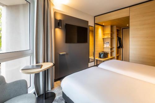Habitación Doble Estándar con 2 camas dobles del hotel ibis Nancy Centre Sainte Catherine. Foto 5