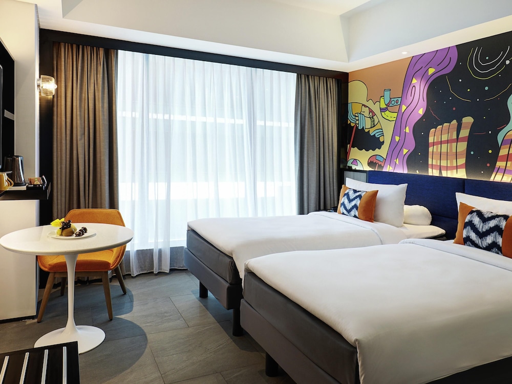 Habitación superior con 2 camas individuales del hotel ibis Styles Jakarta Tanah Abang. Foto 3