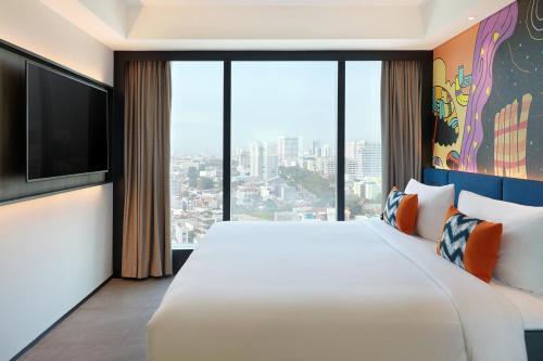 HABITACIÓN FAMILIAR CON 1 CAMA KING del hotel ibis Styles Jakarta Tanah Abang. Foto 4