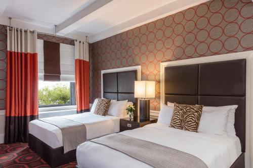 Habitación doble Lujo Con Vistas Con Vistas Sofá Cama incluido Sofá Cama incluido 2 Camas dobles 2 Camas dobles del hotel Empire