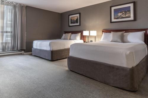 Suite de 1 dormitorio - 2 camas grandes del hotel Faubourg Montreal. Foto 9