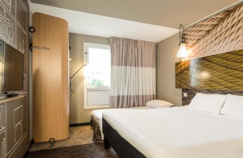 Habitación Doble Estándar con sofá del hotel Ibis Paris Place D'Italie 13ème. Foto 3
