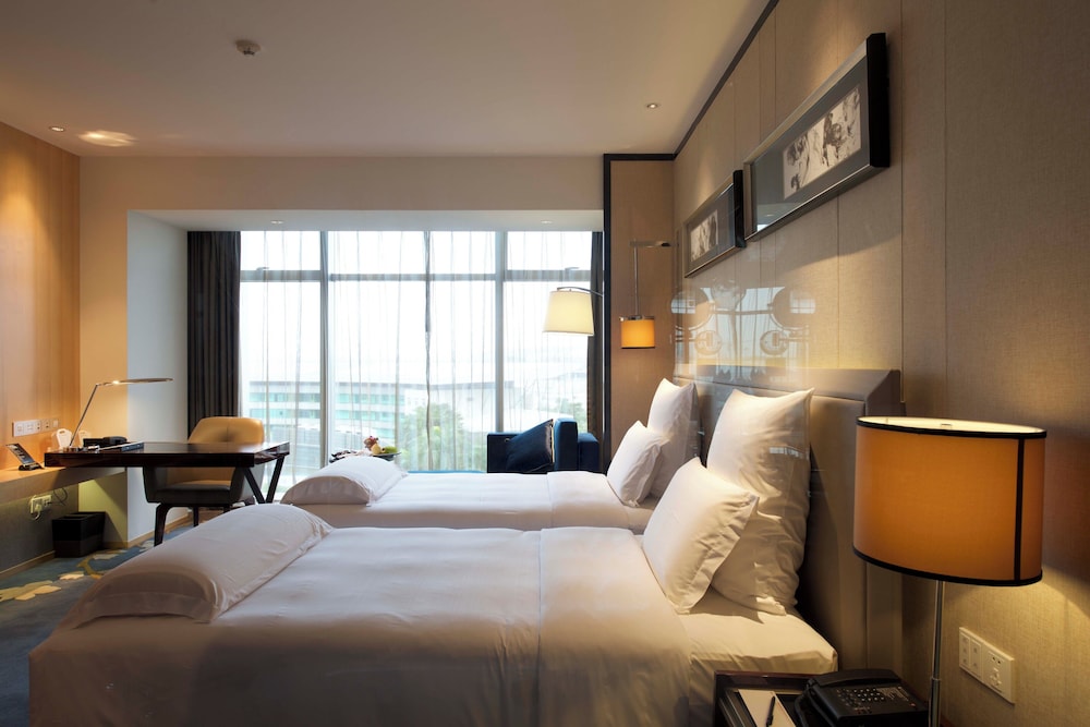 HABITACIÓN EJECUTIVA, Salón Ejecutivo, Dos Camas Individuales, Vistas al Aeropuerto del hotel Pullman Guangzhou Baiyun Airport. Foto 2