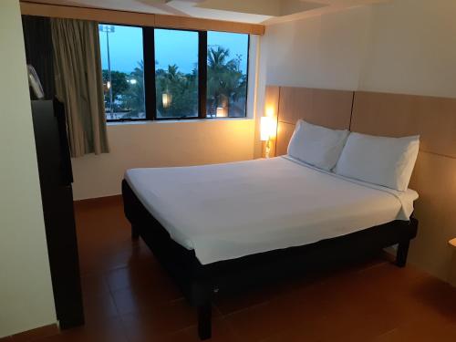 Habitación Doble Estándar del hotel Ibis Maceio Pajucara. Foto 5