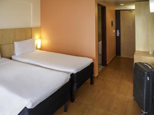 Habitación Doble Estándar - 2 camas del hotel Ibis Maceio Pajucara. Foto 1