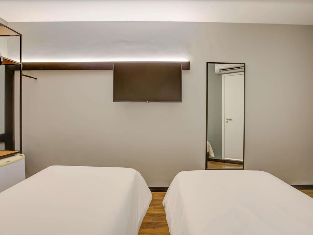 Habitación Standard con 2 camas individuales del hotel Ibis Rio De Janeiro Santos Dumont. Foto 6