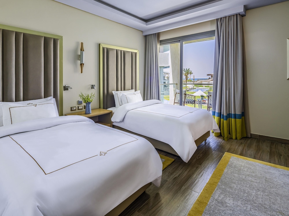Lagoon Deluxe Suite Twin beds Sea View del hotel Rixos Premium Magawish Suites and Villas