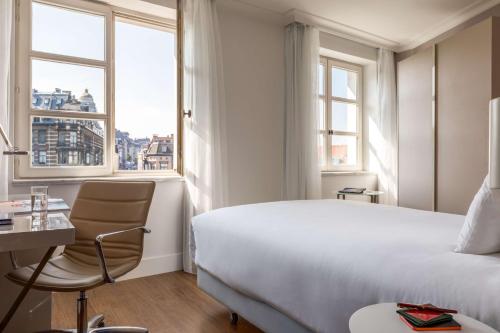 Habitación Familiar con vistas del hotel Nh Collection Brussels Grand Sablon. Foto 2