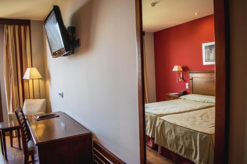 Habitación Doble con cama supletoria - 1 o 2 camas del hotel Campos De Baeza. Foto 6