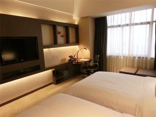 Habitación Doble Deluxe - 2 camas del hotel Baiyun Guangzhou. Foto 1