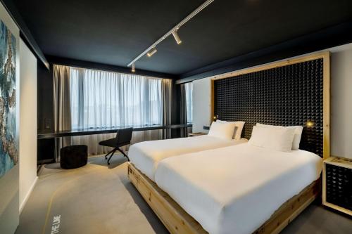 Habitación Atelier del hotel Nhow Brussels Bloom.. Foto 11