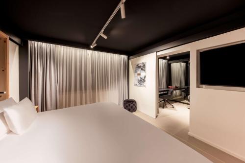 Suite Junior Art con cama supletoria del hotel Nhow Brussels Bloom.. Foto 11