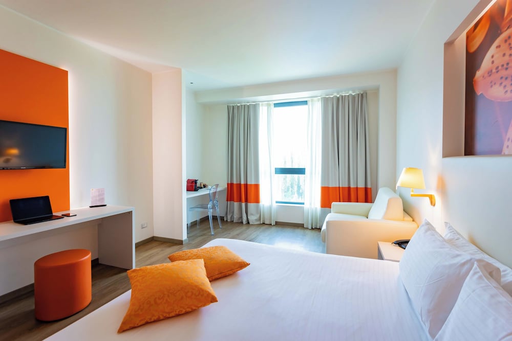 Habitación triple ejecutiva del hotel Ibis Styles Milano Est Settala