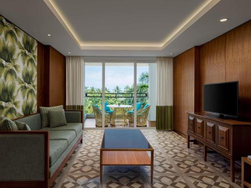 Suite Premium - Cama extragrande del hotel Mövenpick Resort and Spa Boracay. Foto 1