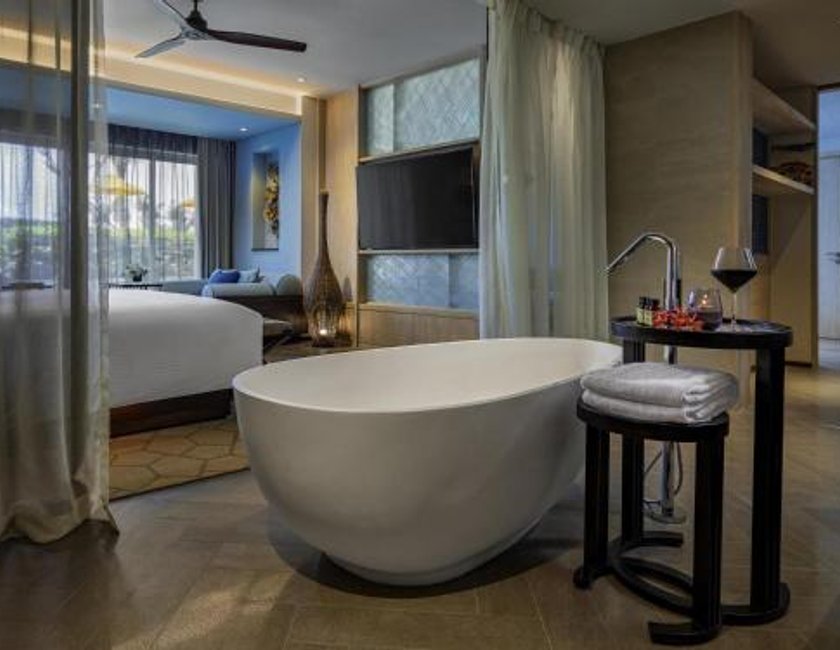 Suite Vista Jardín Balcón o Terraza 1 Cama king 2 habitaciones Privilege Business Con Vistas 2 Camas individuales del hotel Pullman Phu Quoc Beach Resort. Foto 3