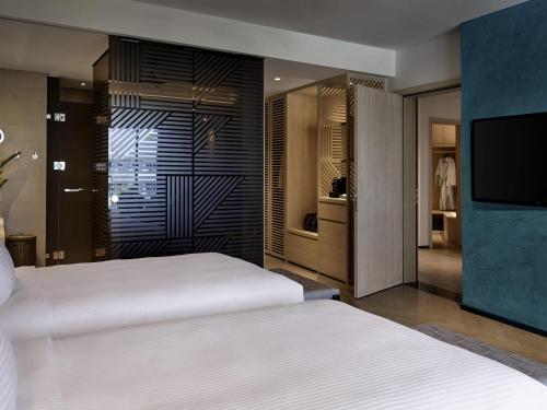 HABITACIÓN DELUXE, 2 Camas Individuales, Vista al Jardín del hotel Pullman Phu Quoc Beach Resort. Foto 1
