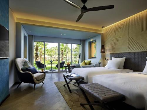 HABITACIÓN DELUXE, 2 Camas Individuales, Vista al Jardín del hotel Pullman Phu Quoc Beach Resort. Foto 2