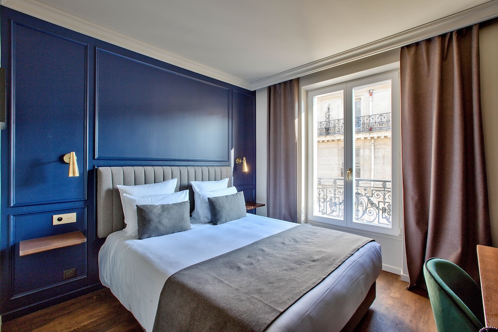 Habitación superior del hotel Maison Barbès. Foto 1