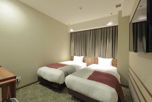 Habitación Doble Económica - 2 camas del hotel Shinsaibashi Grand Osaka. Foto 9