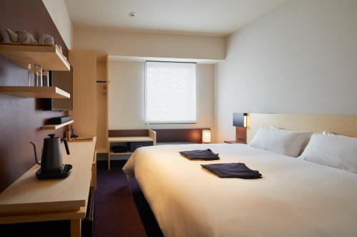 Habitación Superior - 1 cama grande del hotel Amanek Kanazawa. Foto 4
