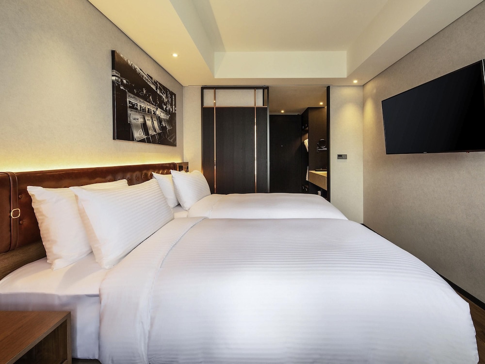 Habitación superior, 2 camas individuales del hotel Mercure Ambassador Seoul Hongdae. Foto 4